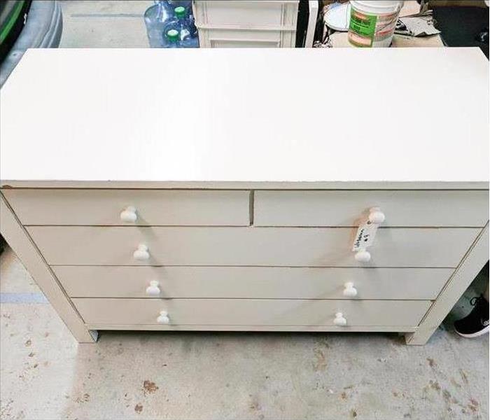 Photo of the same white dresser after cleaning, looking as good as new