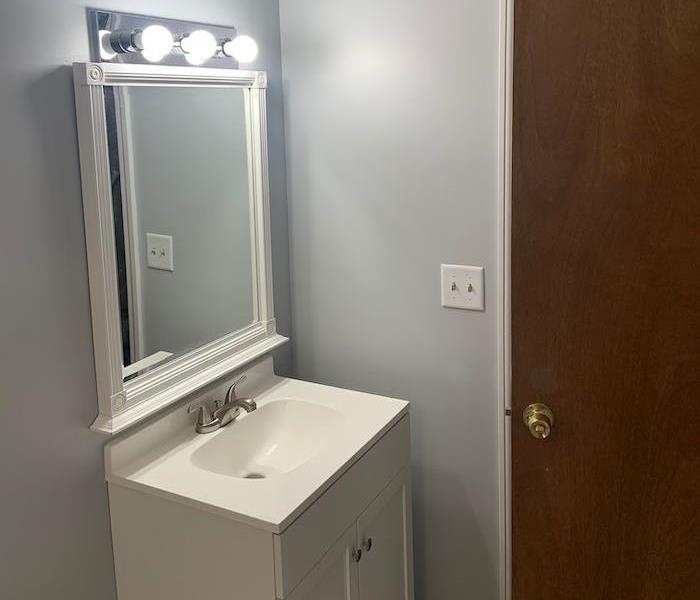  Bathroom with white walls and white vanity 